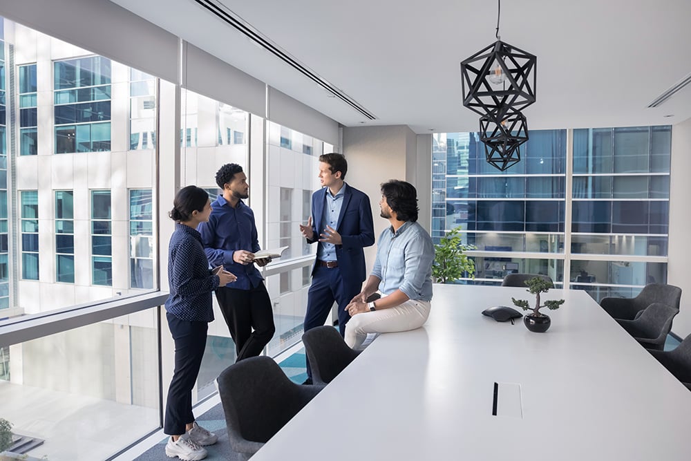 Casually dressed business professionals talking in an conference room Casually dressed business professionals talking in an conference room