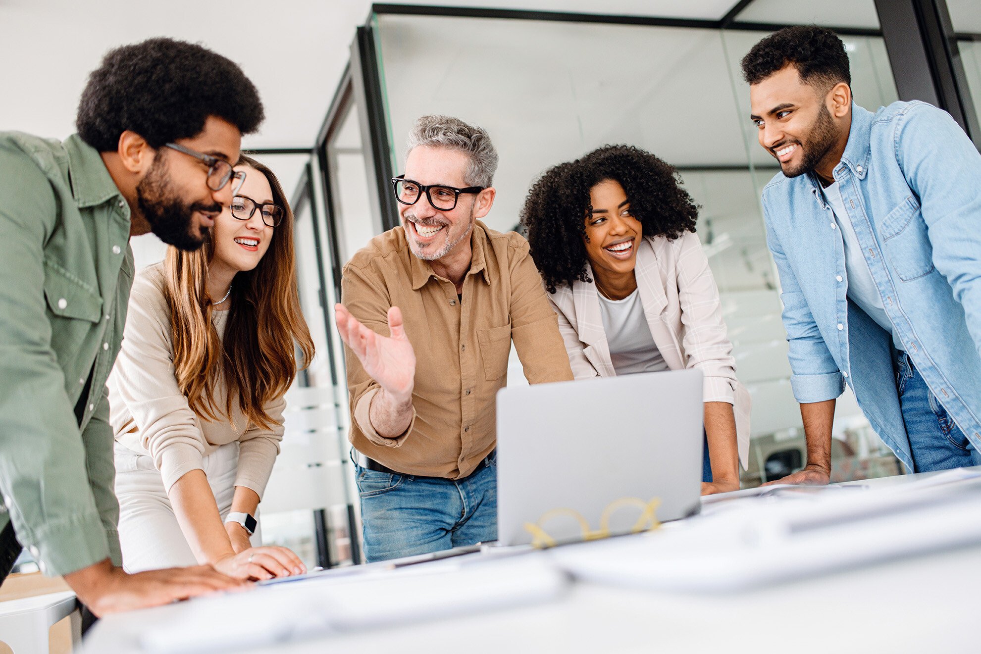 happy-creatives-working-together-as-1124976857