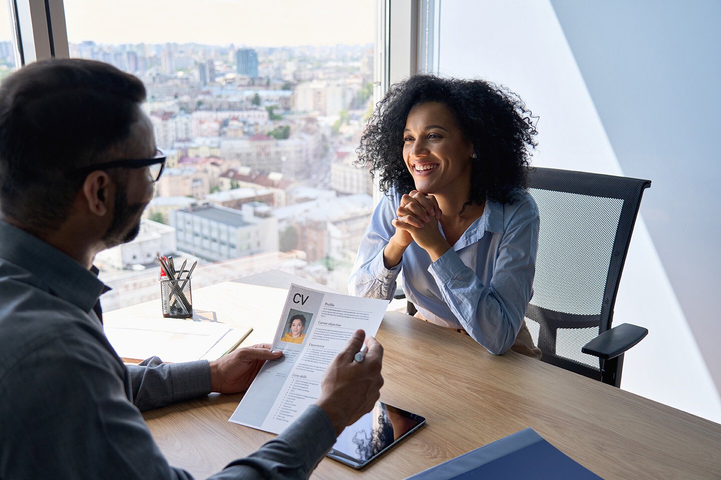 A job interview conducted in a high rise office building.